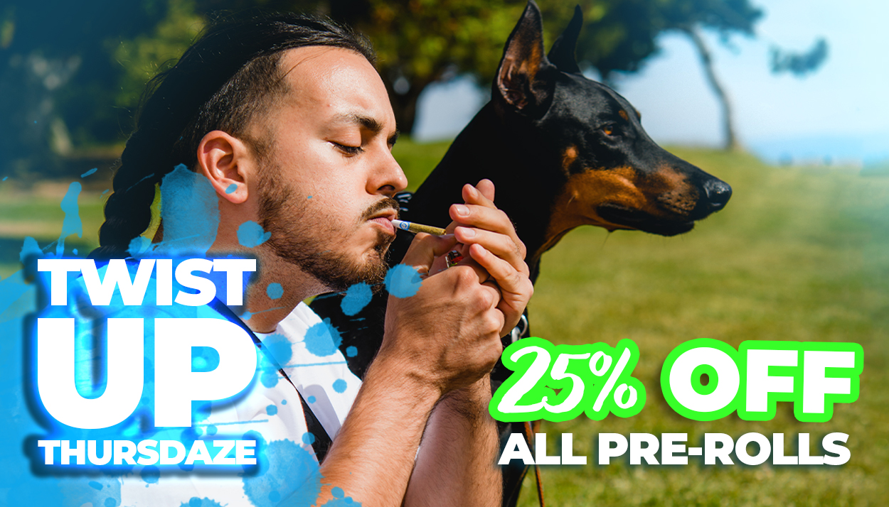 Promotional graphic for Twist Up Thursdaze featuring a man lighting a pre-roll in a park with a Doberman beside him. Blue paint splatter accents frame the image. Text reads: "Twist Up Thursdaze – 25% Off All Pre-Rolls."